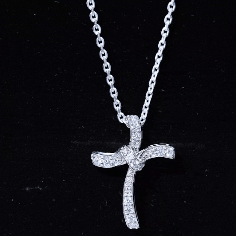 Yellow gold Catholic cross pendant with a certified lab-grown diamond, showcasing intricate design from Rosec Jewels.