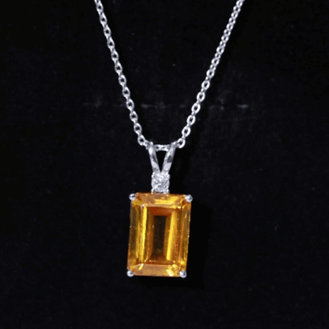 Yellow sapphire pendant with emerald cut on silver chain, lab-grown 9 carats, featured in a Rosec Jewels pendant image.