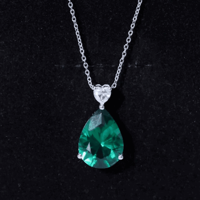 Lab grown emerald pendant necklace with chain, featuring a 9-carat statement emerald from Rosec Jewels.