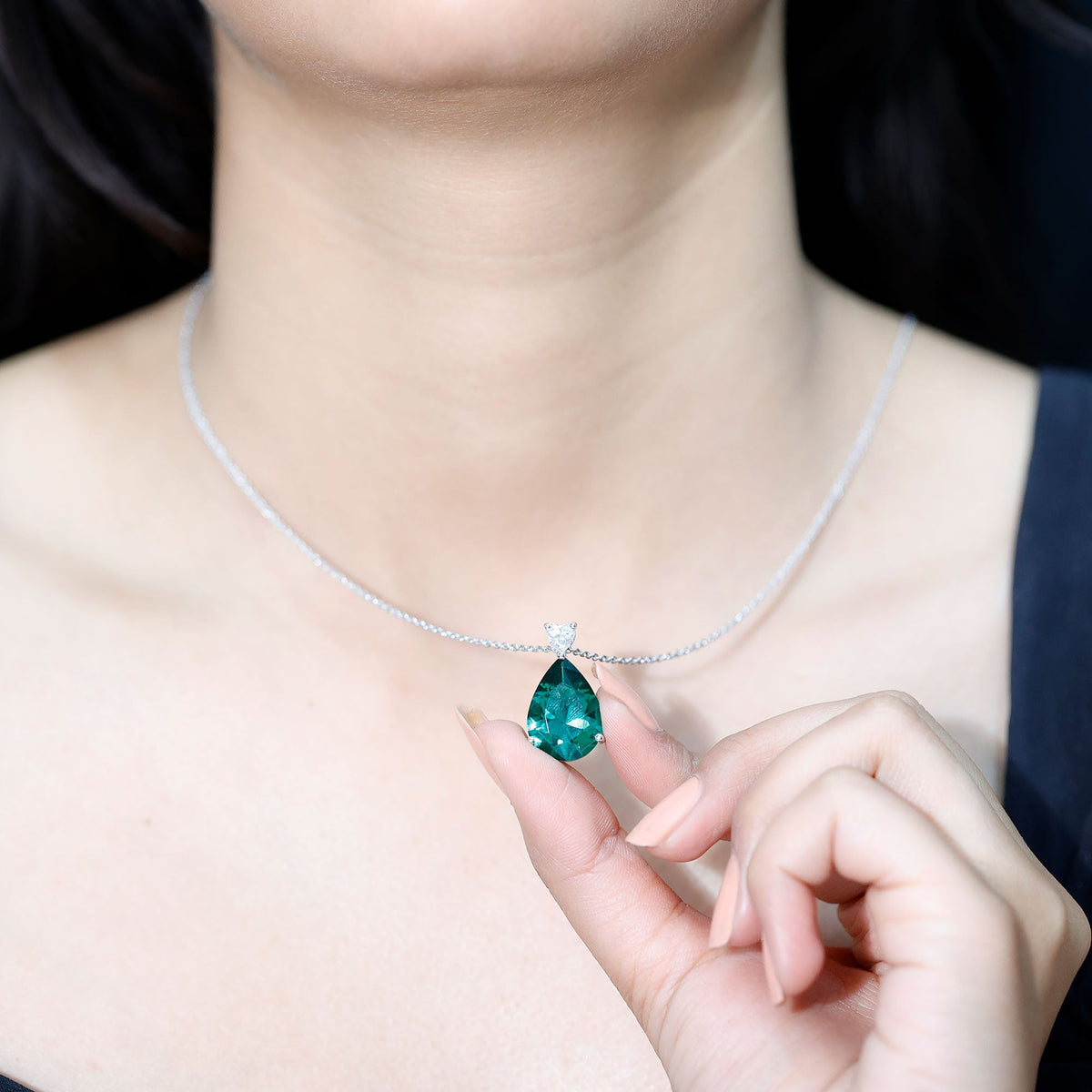 Lab-grown emerald pendant necklace with chain, 9 carats, from Rosec Jewels, featuring a vibrant green statement gemstone.