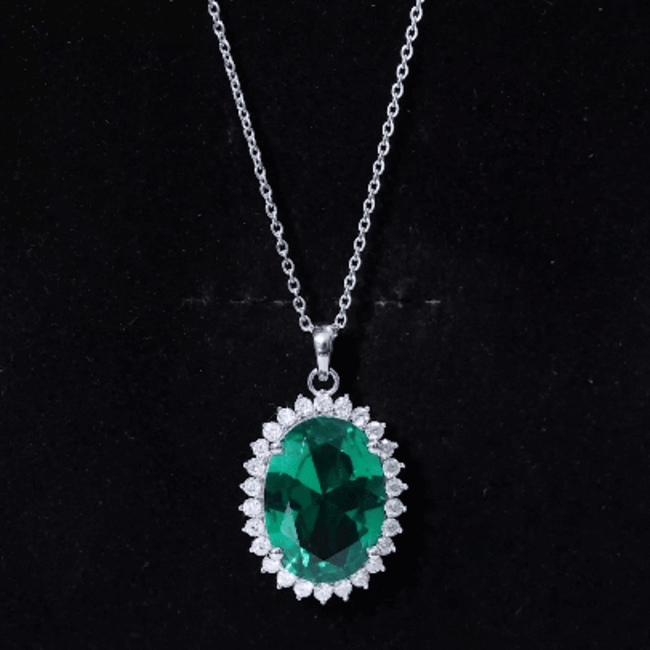 Lab grown emerald pendant necklace by Rosec Jewels featuring a 14 carat emerald on a silver chain.