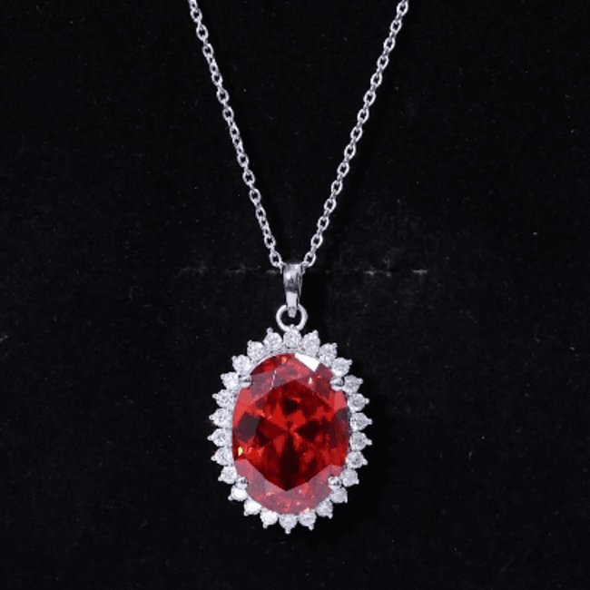 Lab grown orange sapphire pendant necklace with silver chain by Rosec Jewels, featuring a vibrant orange gemstone centerpiece.
