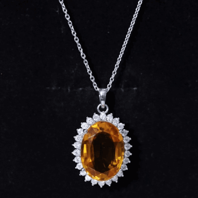 Lab-grown yellow sapphire pendant necklace with silver chain from Rosec Jewels, featuring a 14 carat certified yellow sapphire pendant.
