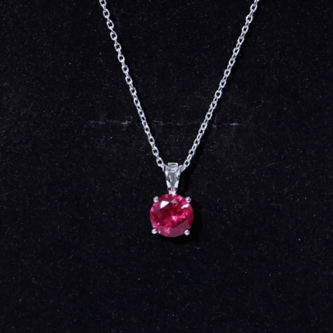 Lab grown 2 carat ruby solitaire pendant necklace with silver chain from Rosec Jewels, showcasing the elegant pendant design.