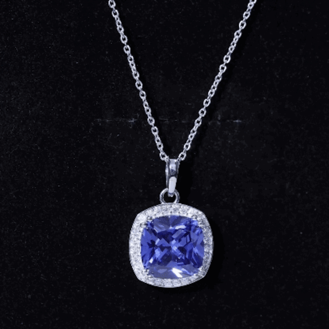 Cushion cut lab-created blue sapphire pendant necklace in 9 carats by Rosec Jewels, featuring a sparkling blue gemstone and elegant design.
