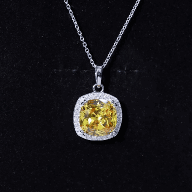 Cushion cut lab yellow sapphire pendant necklace with silver chain from Rosec Jewels, showcasing a vibrant yellow gemstone.
