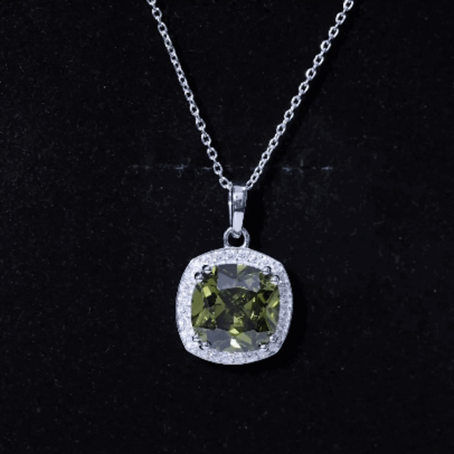 Cushion cut green lab-grown sapphire pendant by Rosec Jewels on a silver chain, showcasing a 9-carat statement necklace.