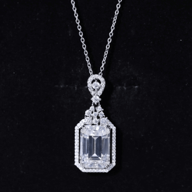 Emerald cut 4.5 carat moissanite wedding pendant with silver chain by Rosec Jewels, showcasing a sparkling gemstone and elegant design.