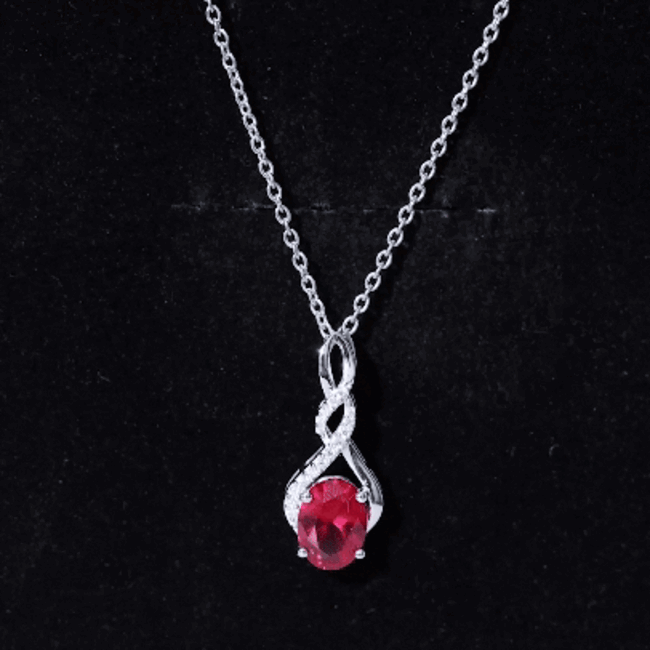 Lab grown 1.5 carat ruby infinity pendant on silver chain by Rosec Jewels, showcasing the sparkling red gemstone and delicate design.