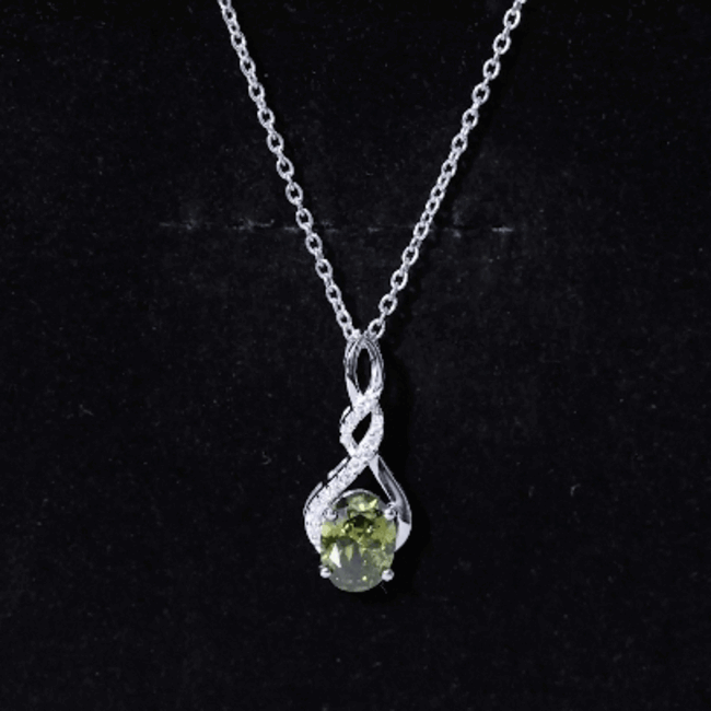 Lab grown green sapphire infinity pendant on silver chain by Rosec Jewels, showcasing a 1.5 carat gemstone and elegant design.