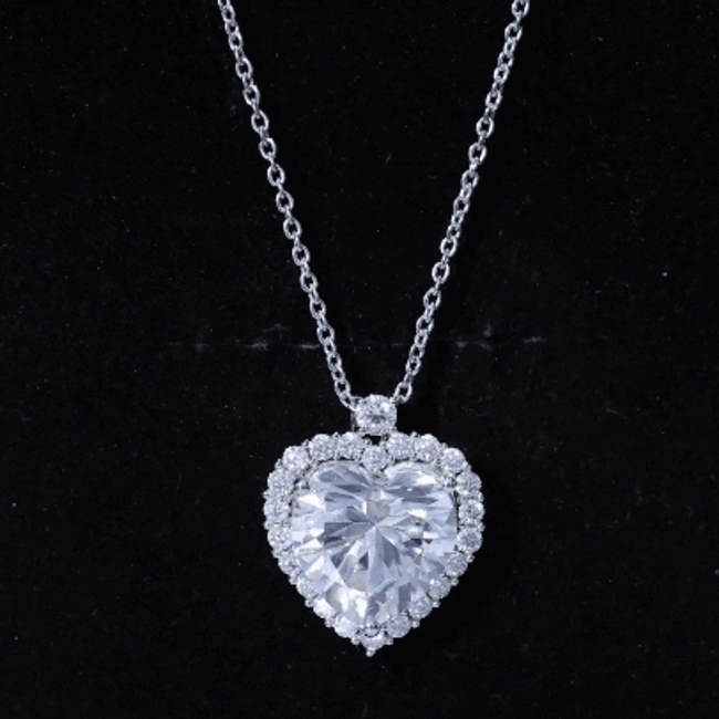 Certified 5.5 carat moissanite heart pendant on silver chain, elegant jewelry piece from Rosec Jewels.