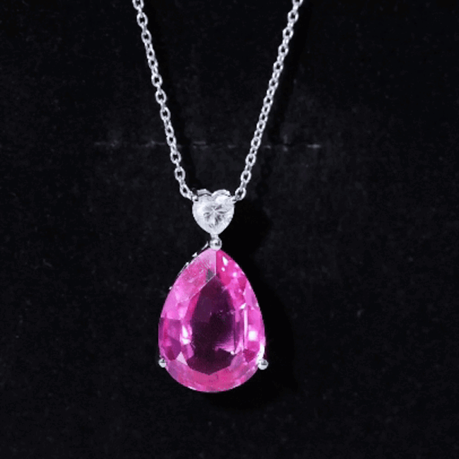 Lab-grown pink sapphire teardrop pendant on silver chain, featuring Rosec Jewels' elegant jewelry design.