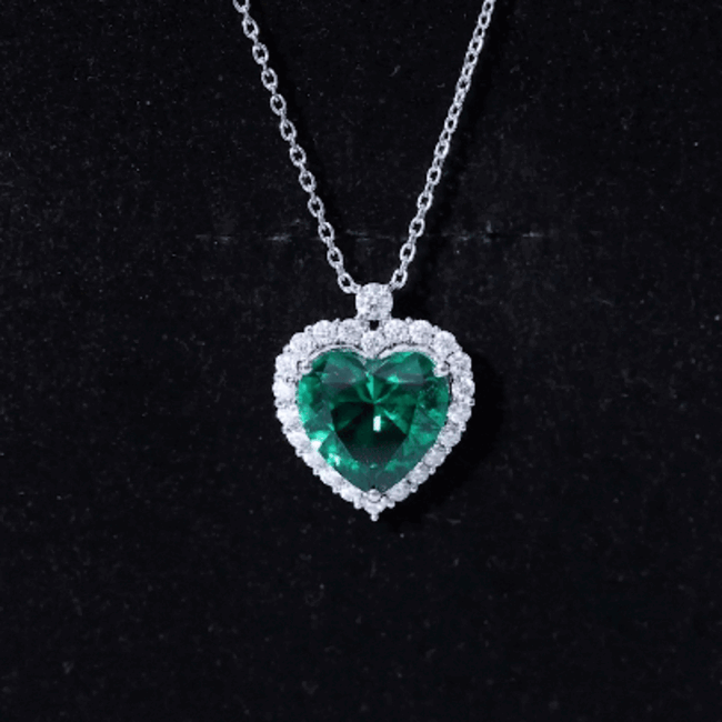 Lab grown 5.5 carat emerald heart pendant on silver chain by Rosec Jewels, showcasing the sparkling gemstone and elegant design.