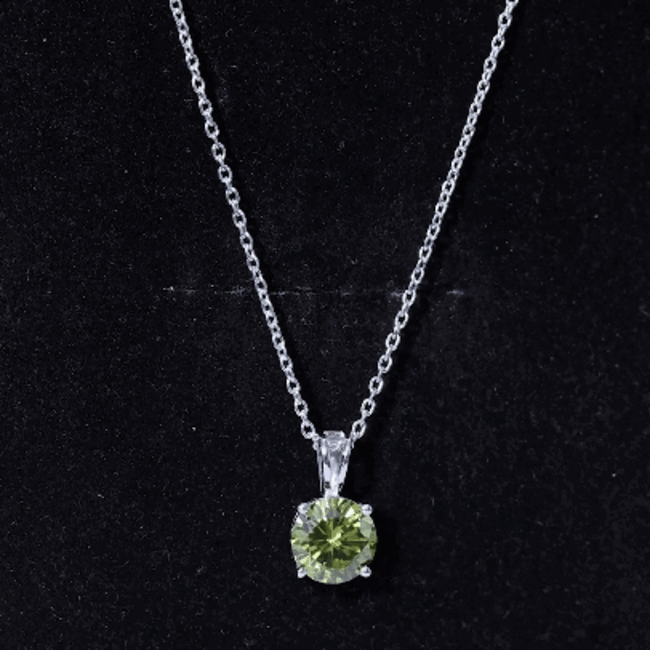 Silver pendant with a 2.25 carat lab-grown green sapphire solitaire set in a Rosec Jewels pendant with a silver chain.