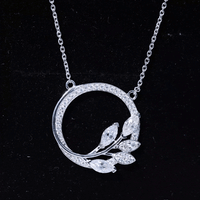 Marquise and round cut moissanite leaf pendant necklace from Rosec Jewels featuring sparkling gemstone leaves on a delicate chain.