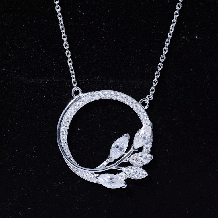 Yellow gold leaf eternity necklace featuring marquise and round cut moissanite pendants by Rosec Jewels