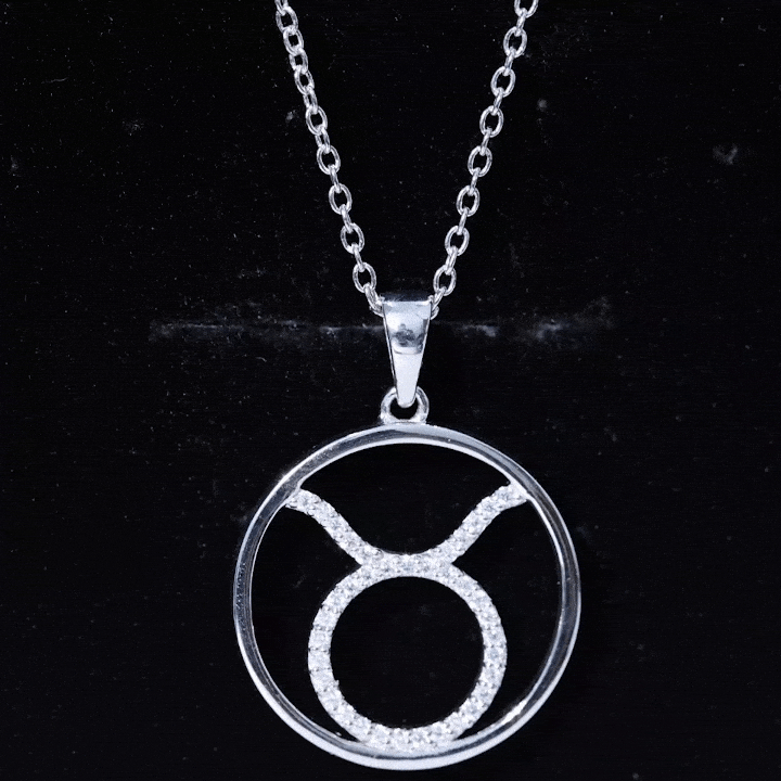 Yellow moissanite Taurus zodiac pendant necklace by Rosec Jewels with a gold-tone chain and engraved Taurus symbol.