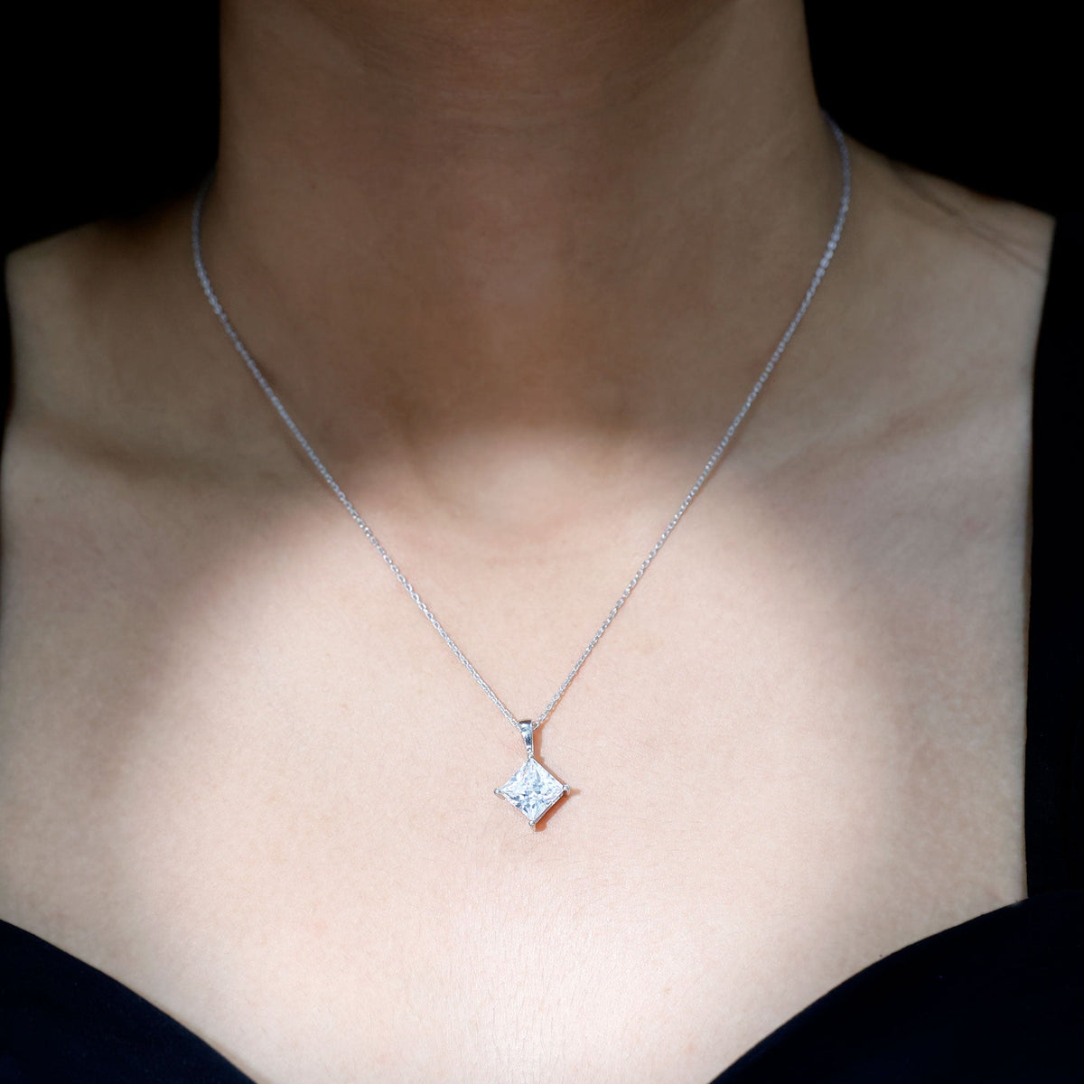 Diagonal set of three carat cubic zirconia princess cut pendants with chain by Rosec Jewels, showcasing sparkling jewelry design