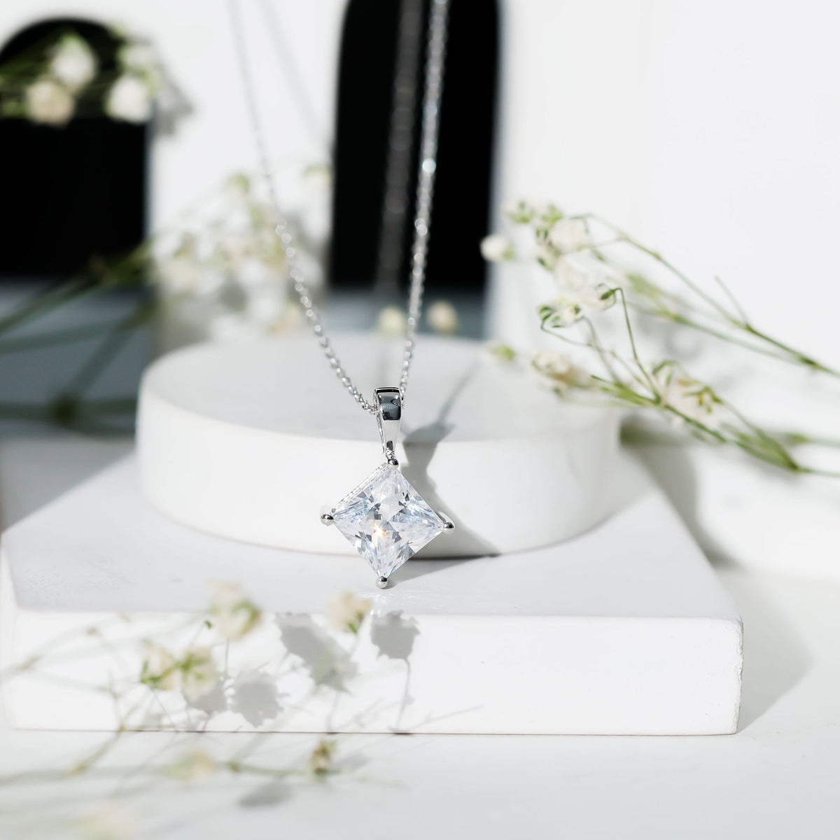 Rosec Jewels diagonal set 3 carat cubic zirconia princess cut pendant with chain, showcasing sparkling jewelry design.