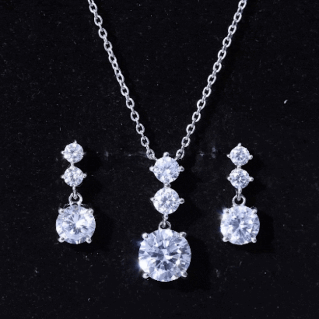 Rosec Jewels cubic zirconia bridal necklace and earrings jewelry set in silver with sparkling white stones.