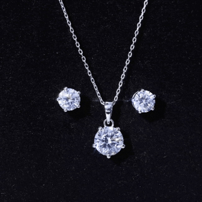 Rosec Jewels cubic zirconia solitaire pendant and earrings set with round 3.9 carat stones, white metal, elegant jewelry design.