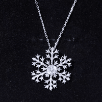 Silver chain necklace featuring a cubic zirconia snowflake pendant from Rosec Jewels, showcasing a sparkling winter-inspired design.