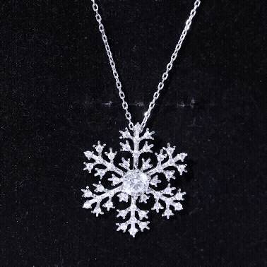 Silver chain necklace featuring a cubic zirconia snowflake pendant from Rosec Jewels, showcasing a sparkling winter-inspired design.