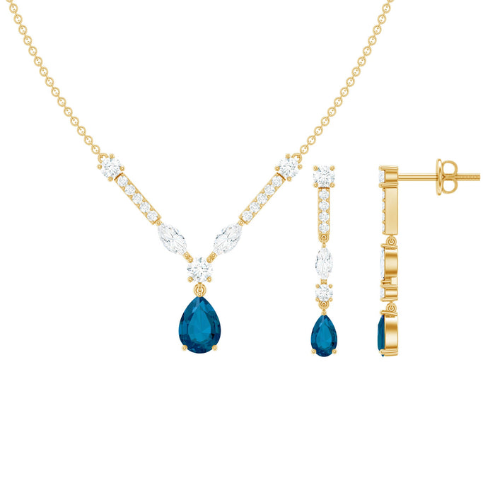 Pear-shaped London Blue Topaz and Moissanite jewelry set including wedding necklace and earrings by Rosec Jewels.