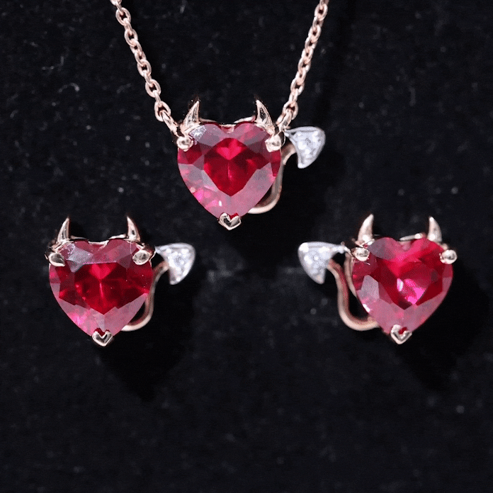 Lab grown ruby heart necklace and earrings set with diamonds from Rosec Jewels, featuring white gemstone accents and elegant design.