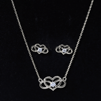 Round cut diamond infinity heart jewelry set featuring sparkling diamonds and elegant design by Rosec Jewels.