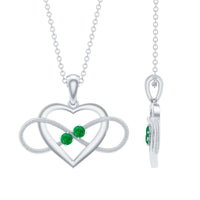 Heart infinity pendant necklace with a real emerald from Rosec Jewels, featuring a delicate silver chain and detailed heart design.