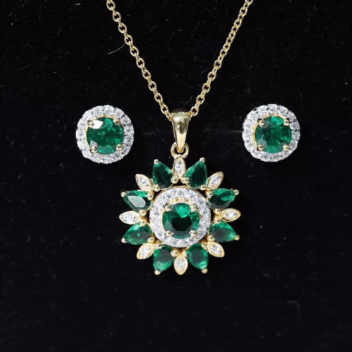 Certified lab-created emerald and diamond flower jewelry set by Rosec Jewels featuring a necklace, earrings, and matching bracelet.
