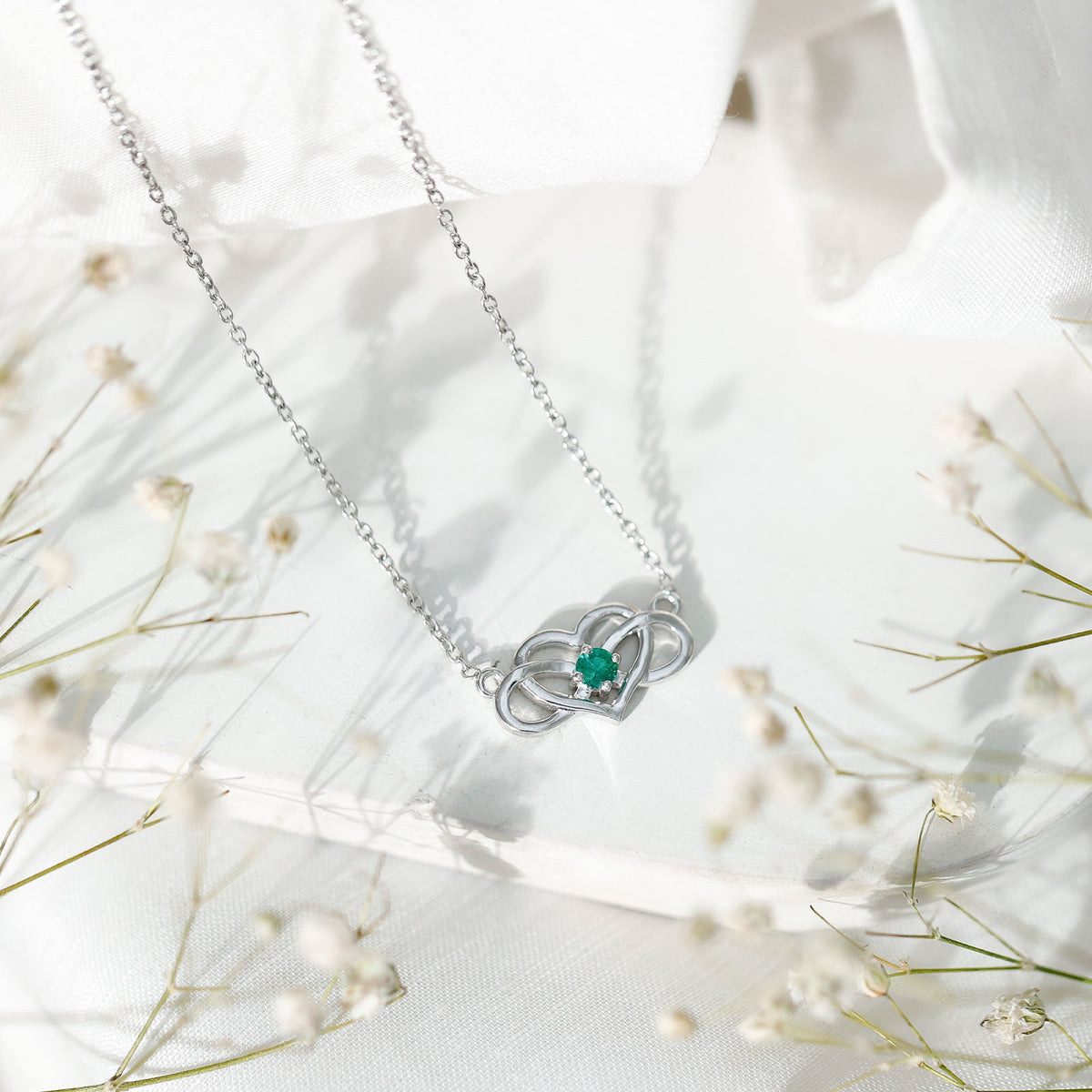 Emerald heart and infinity pendant necklace for women by Rosec Jewels, featuring a delicate chain and intricate design.