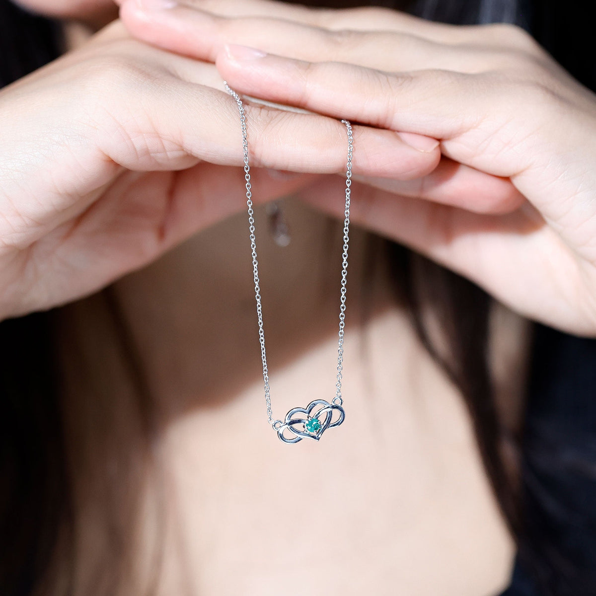 Emerald heart and infinity pendant necklace for women by Rosec Jewels, showcasing a delicate chain with detailed pendant design.