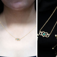 Emerald heart and infinity pendant necklace for women by Rosec Jewels, featuring a delicate chain and sparkling green gemstone charm.
