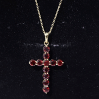 Genuine garnet cross pendant necklace from Rosec Jewels featuring a white background and intricate design.
