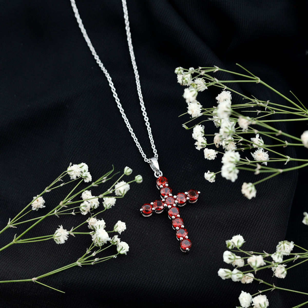 Genuine garnet cross pendant necklace from Rosec Jewels featuring a polished gold-tone design and detailed cross-shaped charm.