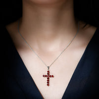 Genuine garnet cross pendant necklace with silver chain from Rosec Jewels, featuring a detailed cross design with deep red garnet gemstone.