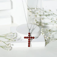 Genuine garnet cross pendant necklace from Rosec Jewels featuring a red gemstone in a silver setting.