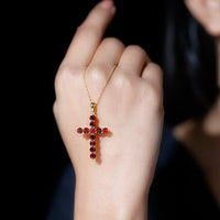 Genuine garnet cross pendant necklace from Rosec Jewels featuring a detailed cross design with a polished gold finish.