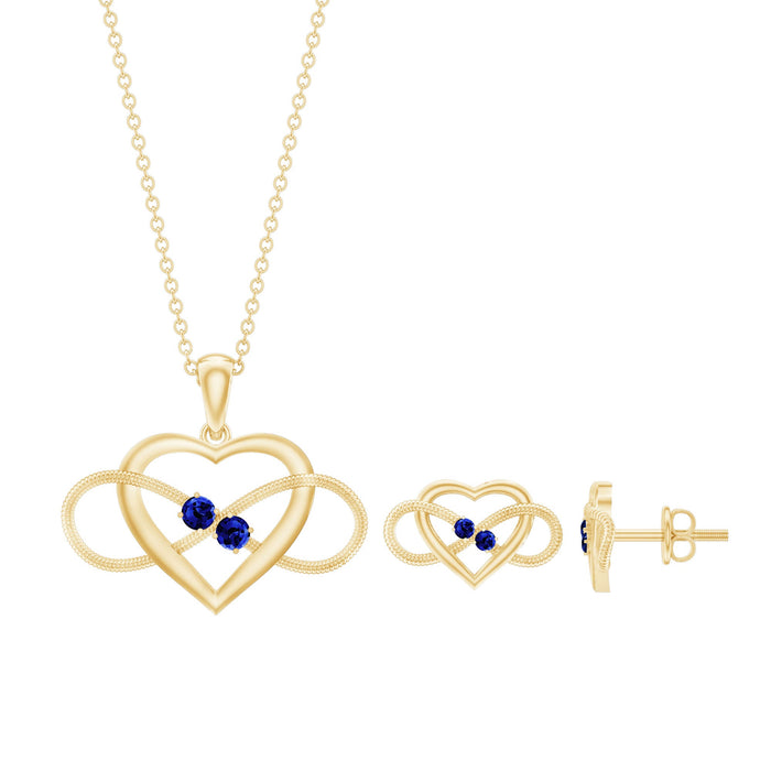 Lab grown blue sapphire infinity heart jewelry set by Rosec Jewels featuring matching necklace and earrings on a white background.
