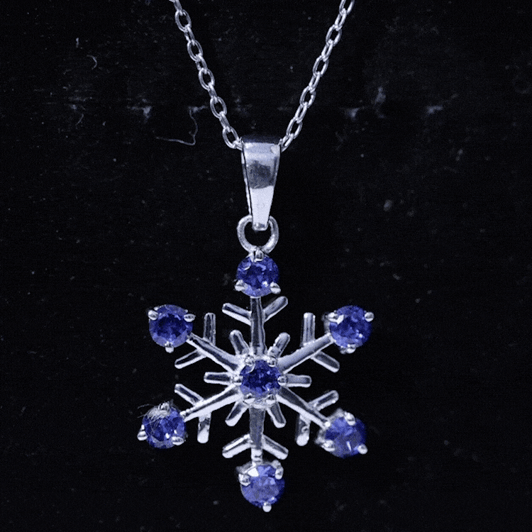 Lab-created blue sapphire snowflake pendant necklace with chain from Rosec Jewels, showcasing a delicate blue sapphire snowflake design.