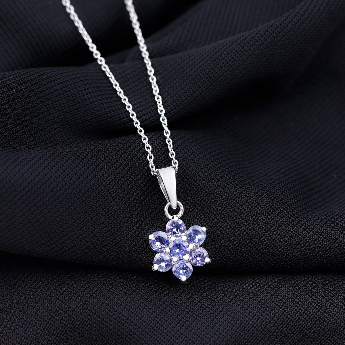 Natural Tanzanite flower cluster pendant necklace featuring vibrant blue gemstones, crafted by Rosec Jewels.