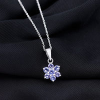 Natural Tanzanite flower cluster pendant necklace featuring vibrant blue gemstones, crafted by Rosec Jewels.