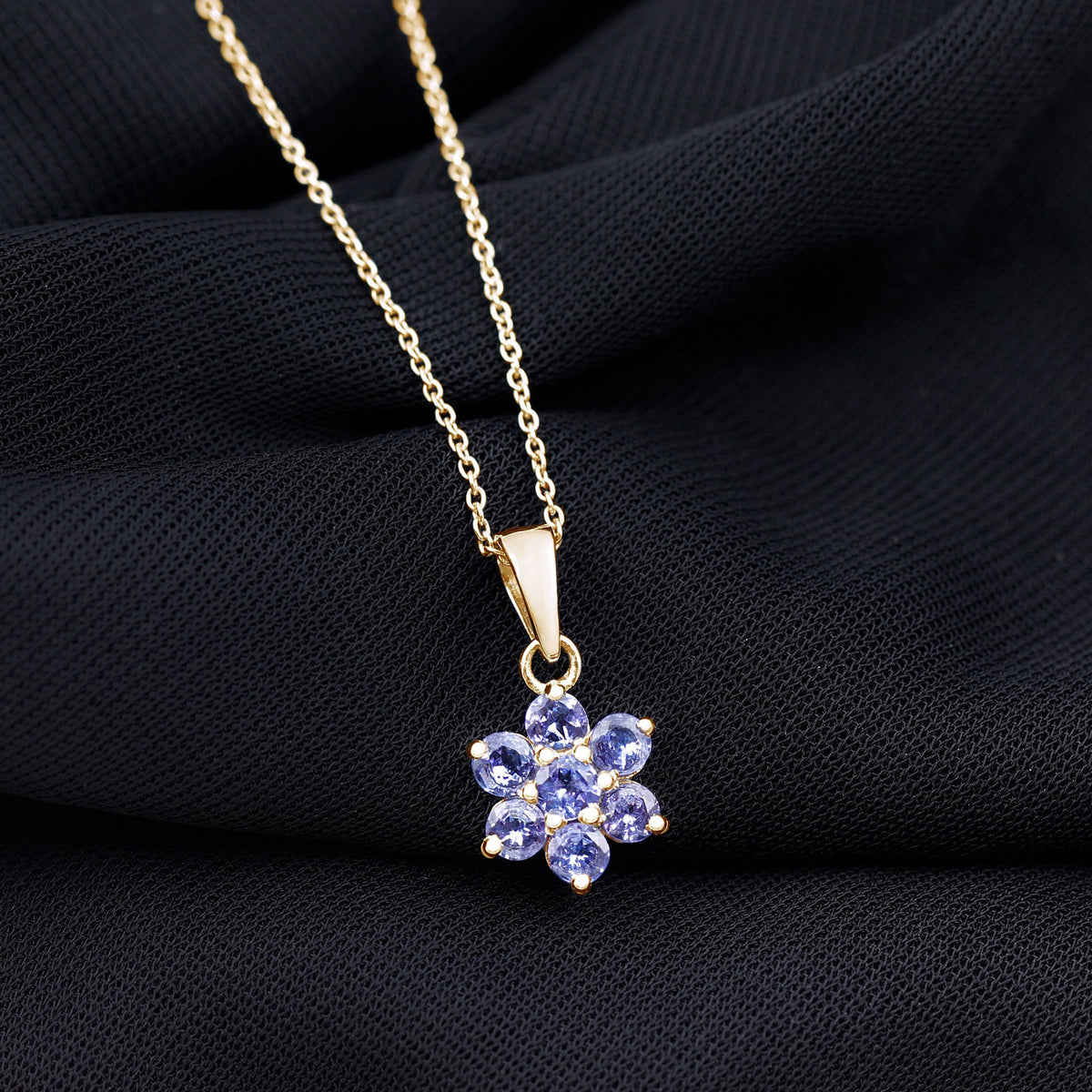 Natural Tanzanite flower cluster pendant necklace featuring vibrant blue stones and intricate floral design by Rosec Jewels.