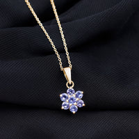 Natural Tanzanite flower cluster pendant necklace featuring vibrant blue stones and intricate floral design by Rosec Jewels.
