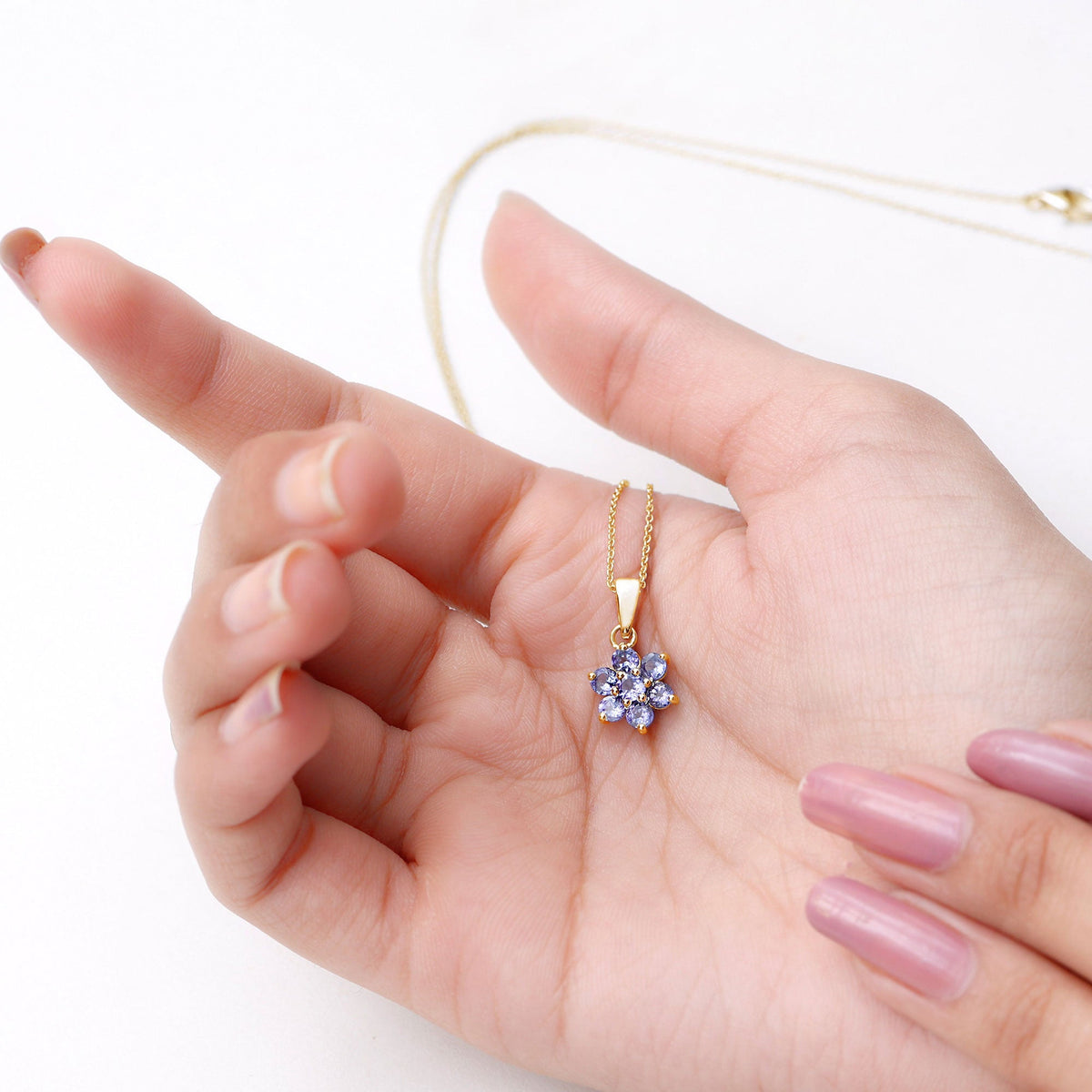 Natural Tanzanite flower cluster pendant necklace by Rosec Jewels featuring a vibrant purple-blue tanzanite gemstone in a floral design.