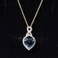 Heart-shaped London Blue Topaz infinity pendant with diamonds, featuring a 2-carat gemstone, from Rosec Jewels.