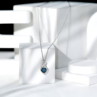 Heart-shaped London Blue Topaz pendant with diamond accents, 2 carats, from Rosec Jewels, showcasing elegant jewelry design.