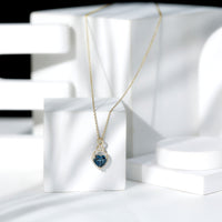 Heart-shaped London Blue Topaz infinity pendant with diamonds, 2 carats, from Rosec Jewels, showcasing elegant jewelry design.